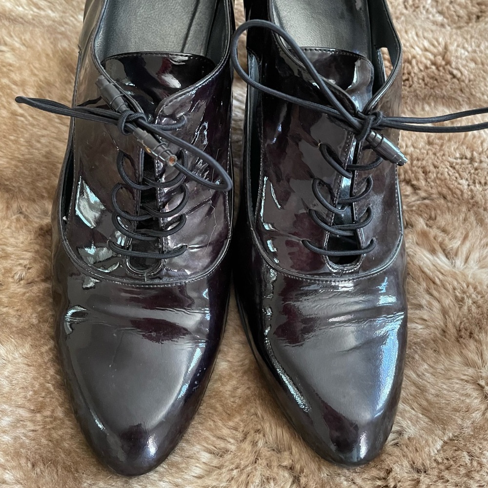 Stuart weitzman patent tie booties